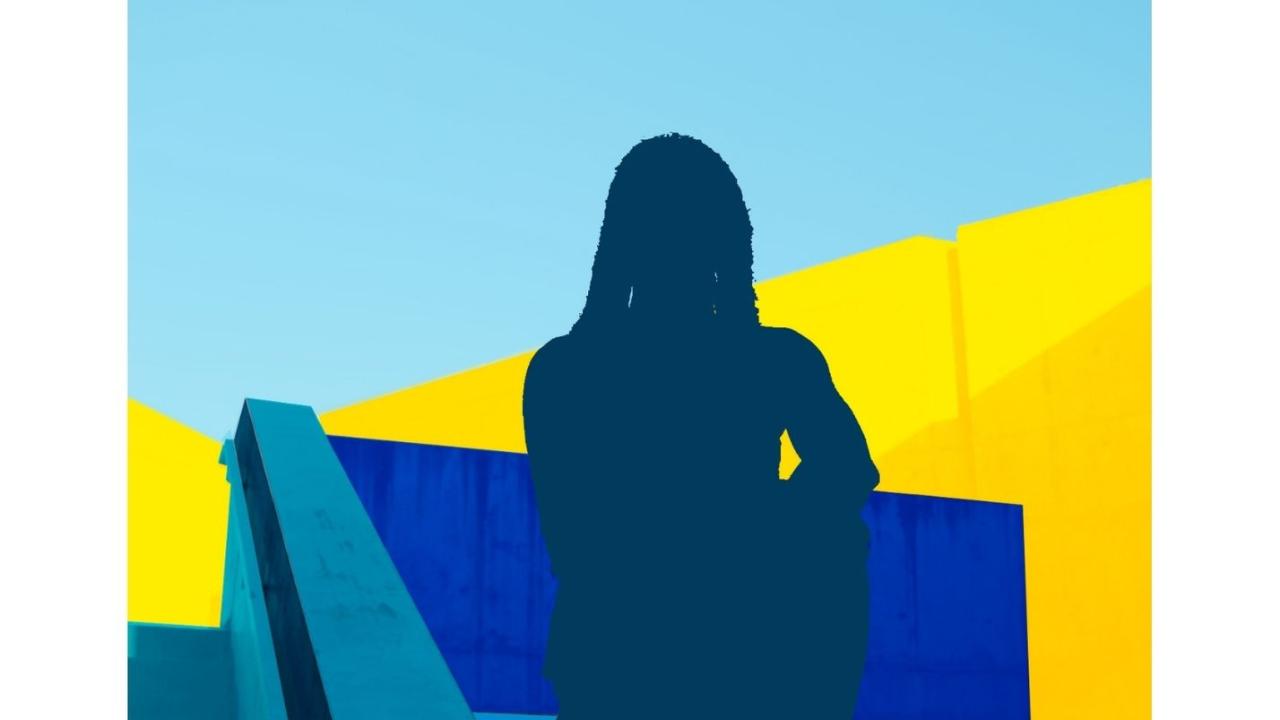 posterized image of young woman sitting outside SSH building